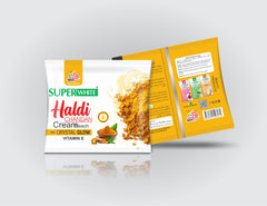 Superwhite Haldi Cream packaging on a gray background